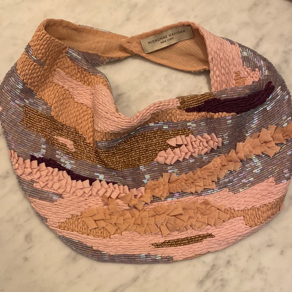 A stunning scarf necklace with exquisite pink, silver, gold and dark purple